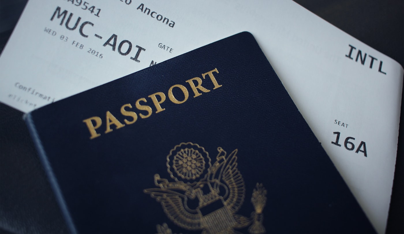 Passports beside a boarding pass